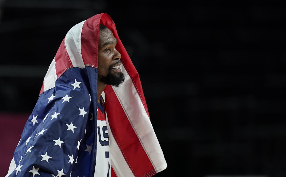 United States' Kevin Durant (7) celebrates after their win in the men's basketball gold medal game against France at the 2020 Summer Olympics, Saturday, Aug. 7, 2021, in Saitama, Japan. (AP Photo/Charlie Neibergall)