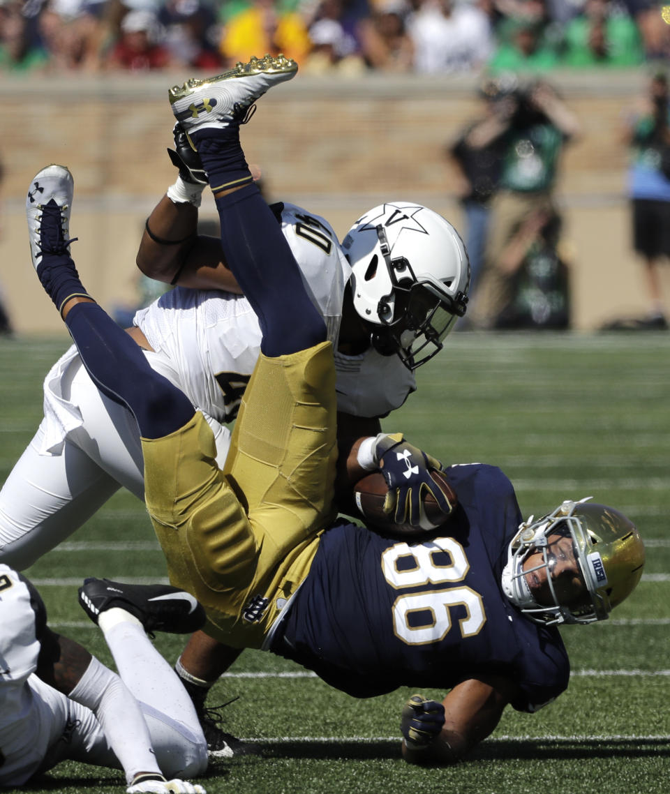 Notre Dame tight end Alize Mack, right, is tackled by Vanderbilt linebacker Jordan Griffin during the first half of an NCAA college football game in South Bend, Ind., Saturday, Sept. 15, 2018. (AP Photo/Nam Y. Huh)