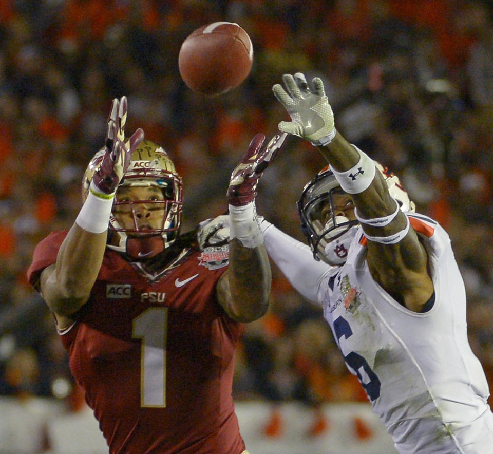 Auburn's Jonathon Mincy (6) breaks up a pass intended for Florida State's Giorgio Newberry during the first half of the NCAA BCS National Championship college football game Monday, Jan. 6, 2014, in Pasadena, Calif. (AP Photo/Mark J. Terrill)