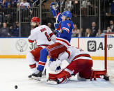 New York Rangers center Filip Chytil (72) collides with Carolina Hurricanes goaltender Frederik Andersen (31) during the second period in Game 2 of an NHL hockey Stanley Cup second-round playoff series Tuesday, May 7, 2024, in New York. At left is Hurricanes defenseman Brent Burns. (AP Photo/Julia Nikhinson)