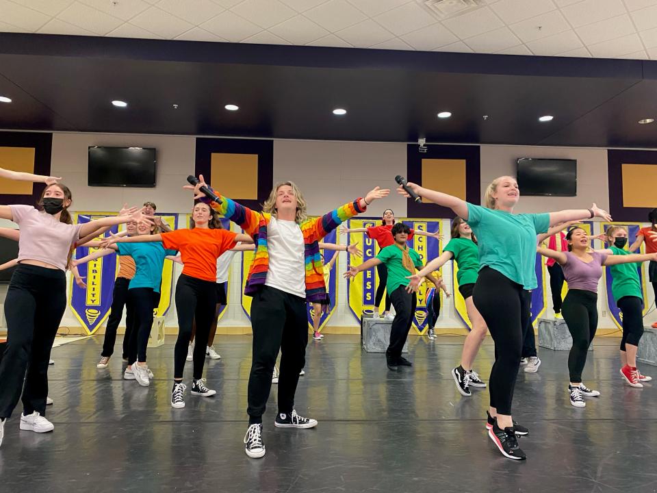 Judah Woomert, center, plays the title role in “Joseph and the Amazing Technicolor Dreamcoat” presented by the theater department at Booker High School’s Visual and Performing Arts Center.