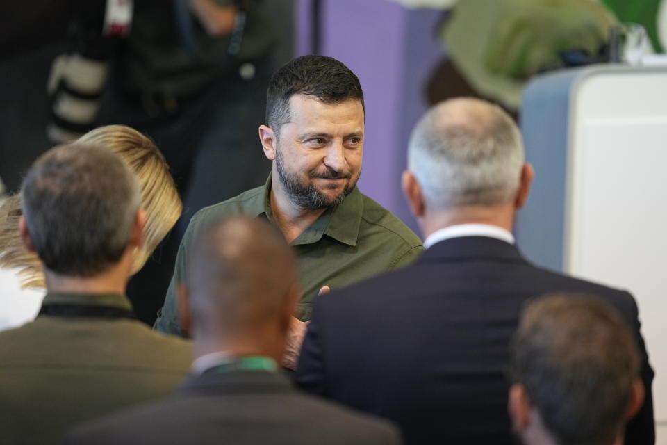 Ukraine's President Volodymyr Zelenskyy greets Danish Members of Parliament after his speech in the Danish Parliament in Copenhagen, Monday Aug. 21, 2023. (Mads Claus Rasmussen/Ritzau Scanpix via AP)