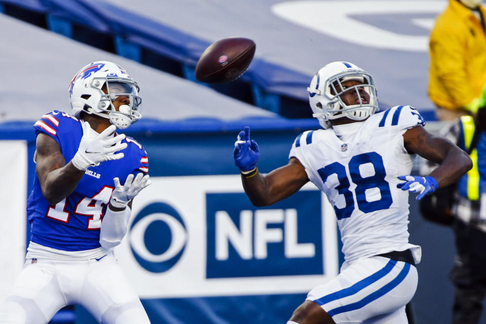 Buffalo Bills' Stefon Diggs (14) catches a pass for a touchdown in front of Indianapolis Colts' T.J. Carrie (38) during the second half of an NFL wild-card playoff football game Saturday, Jan. 9, 2021, in Orchard Park, N.Y. (AP Photo/Jeffrey T. Barnes)