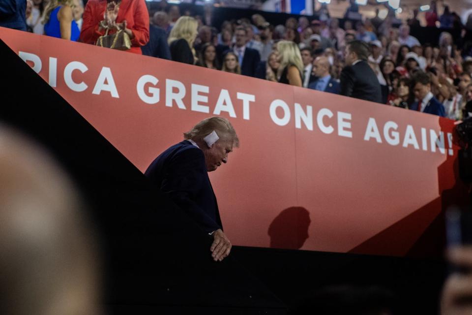 Trump arrives with his ear bandaged for the first time at the Republican National Convention, days after the assassination attempt 