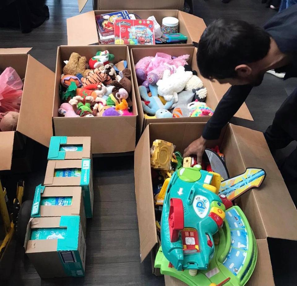 Anwar Zazay delivering  nail clippers, toiletries, and other soft toys for Afghans with charity Afghan Youth Society (Anwar Zazay)