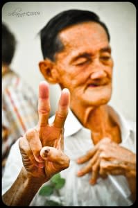 Old man giving V Sign