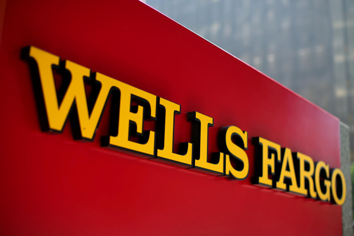 FILE PHOTO: A Wells Fargo bank sign is pictured in downtown Los Angeles, California, U.S. August 10, 2017. REUTERS/Mike Blake/File Photo