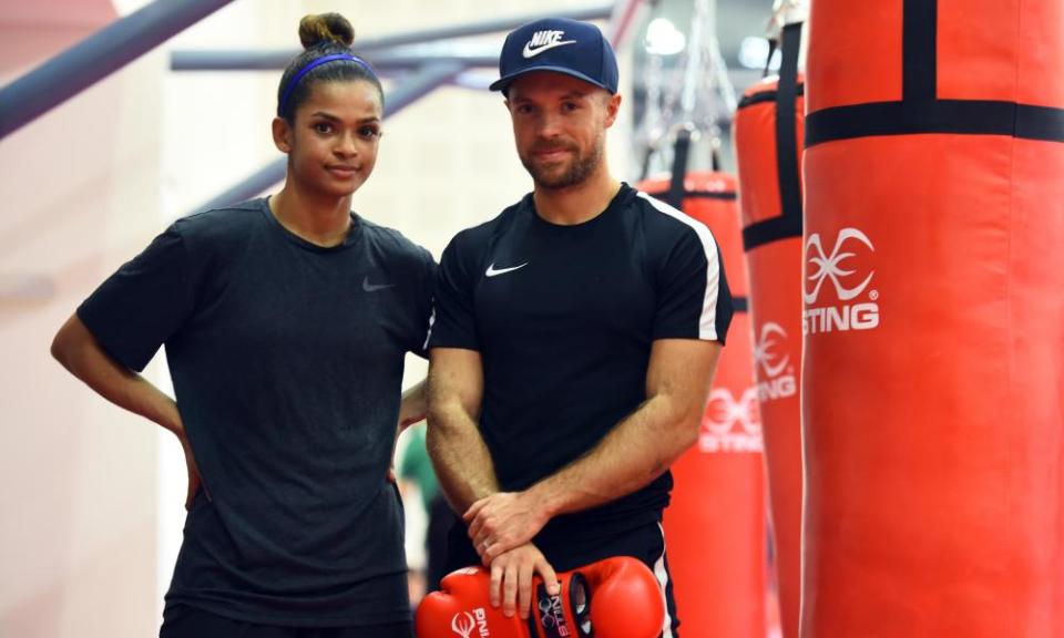 Ali with her husband Richard Moore, 2018 by punch bags.