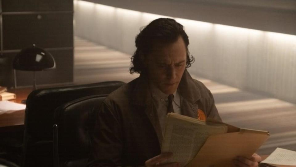 An image from Loki episode two shows Loki reading some papers