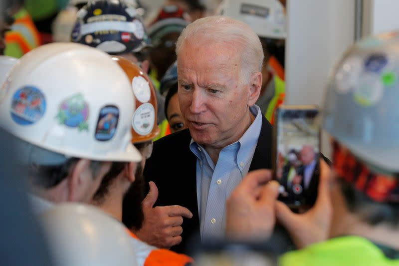 FILE PHOTO: Democratic U.S. presidential candidate and former Vice President Joe Biden argues with a worker about his positions on gun control during a campaign stop at a plant in Detroit, Michigan