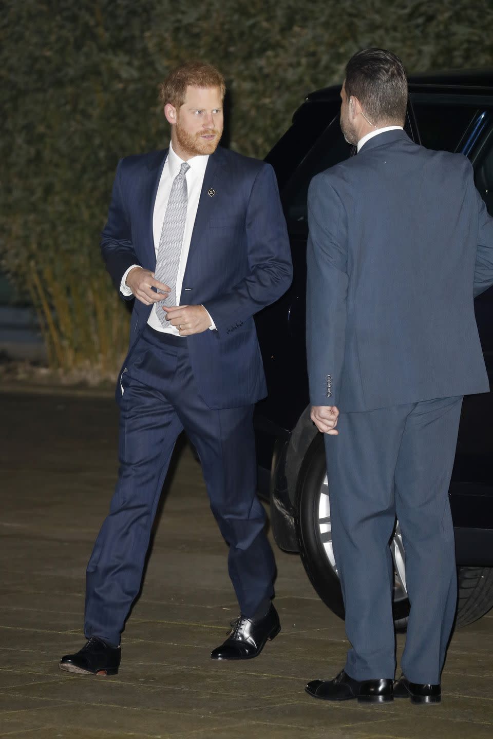 Harry wore a navy suit for the occasion.