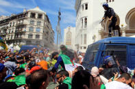 A police officer sprays tear gas during an anti-government protest in Algiers, Algeria May 17, 2019. REUTERS/Ramzi Boudina