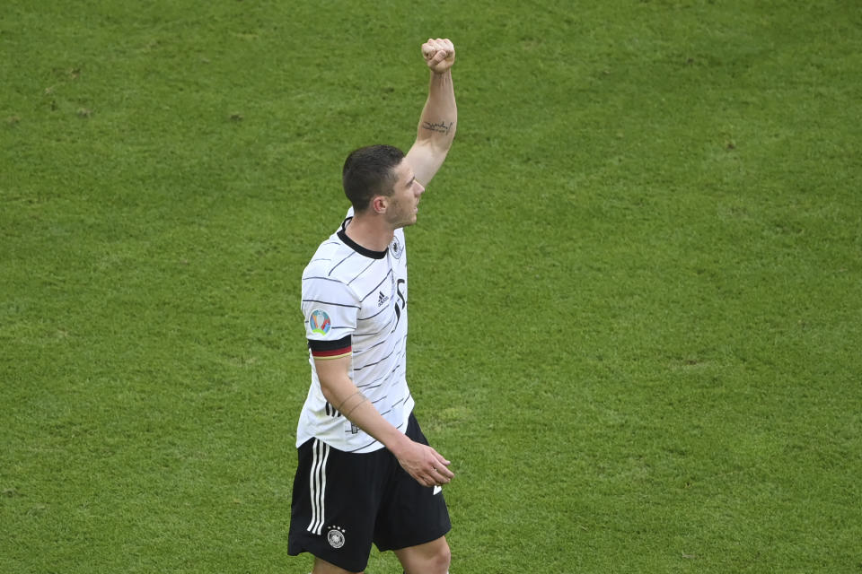 Germany's Robin Gosens celebrates after scoring his side's fourth goal during the Euro 2020 soccer championship group F match between Portugal and Germany at the football arena stadium in Munich, Saturday, June 19, 2021. (Matthias Hangst/Pool Photo via AP)