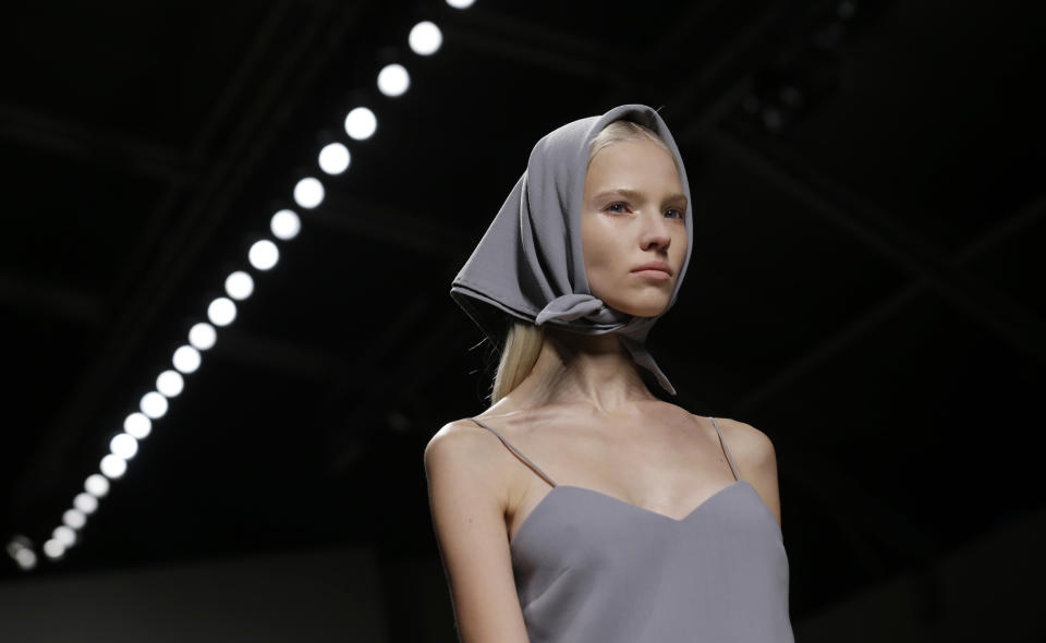 A model wears a creation for Max Mara women's Spring-Summer 2014 collection, part of the Milan Fashion Week, unveiled in Milan, Italy, Thursday, Sept. 19, 2013. (AP Photo/Luca Bruno)