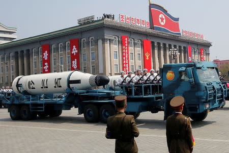 FILE PHOTO - Military vehicles carry missiles with characters reading 'Pukkuksong' during a military parade marking the 105th birth anniversary of North Korea's founding father, Kim Il Sung, in Pyongyang, April 15, 2017. REUTERS/Sue-Lin Wong/File photo