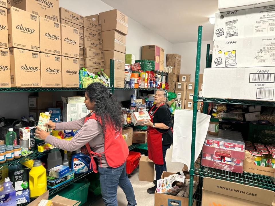 Staff and volunteers at the Salvation Army food bank in Sydney prepare for the Christmas distribution.