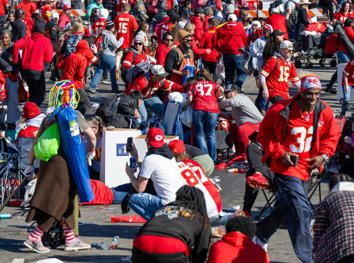 After gunfire broke out at the Kansas City Chiefs Super Bowl rally on Wednesday, Feb. 14, 2024, fans took cover and other fled the area around Union Station. One person was killed by gunfire and twenty-two others were shot and wounded, some critically.