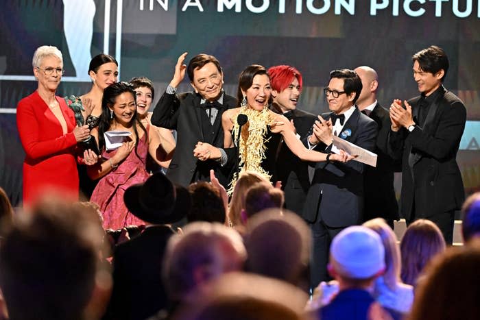 Jamie Lee Curtis, Jenny Slate, Stephanie Hsu, Tallie Medel, Brian Le, James Hong, Andy Le, Michelle Yeoh, Ke Huy Quan and Harry Shum Jr. accept the Outstanding Performance by a Cast in a Motion Picture award for "Everything Everywhere All at Once"