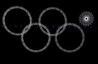 Four out of five Olympic rings are seen lit up during the opening ceremony of the 2014 Sochi Winter Olympics, February 7, 2014. REUTERS/David Gray