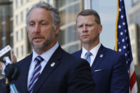 Acting Director of U.S. Immigration and Customs Enforcement Matt Albence comments Thursday, Aug. 6, 2020, in Jackson, Miss., after the announcement of the indictments of four executives from two Mississippi poultry processing plants on federal charges tied to one of the largest workplace immigration raids in the U.S. in the past decade. Their announcement happened a day before the one-year anniversary of the raids in which 680 people were arrested at seven poultry plants in central Mississippi. U.S. Attorney Mike Hurst listens in rear. (AP Photo/Rogelio V. Solis)