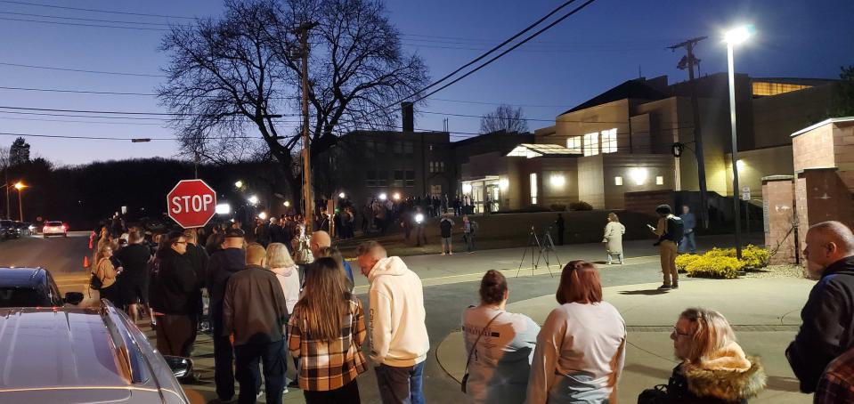 A line of residents waiting to get into a public meeting in East Palestine, Ohio on Wednesday night (Graig Graziosi/The Independent)