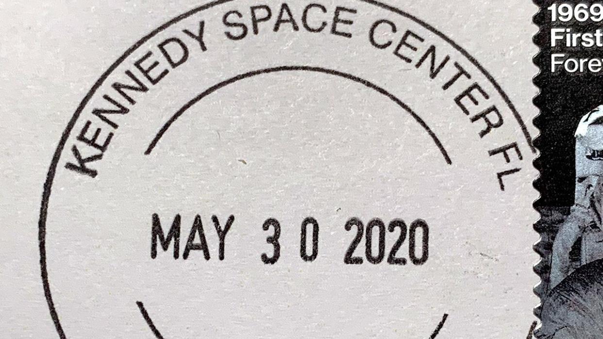  A stamp that reads "kennedy space center". 