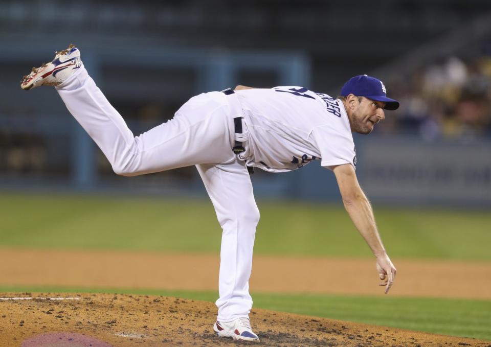 Dodgers pitcher Max Scherzer follows through as he delivers a pitch against the San Diego Padres.