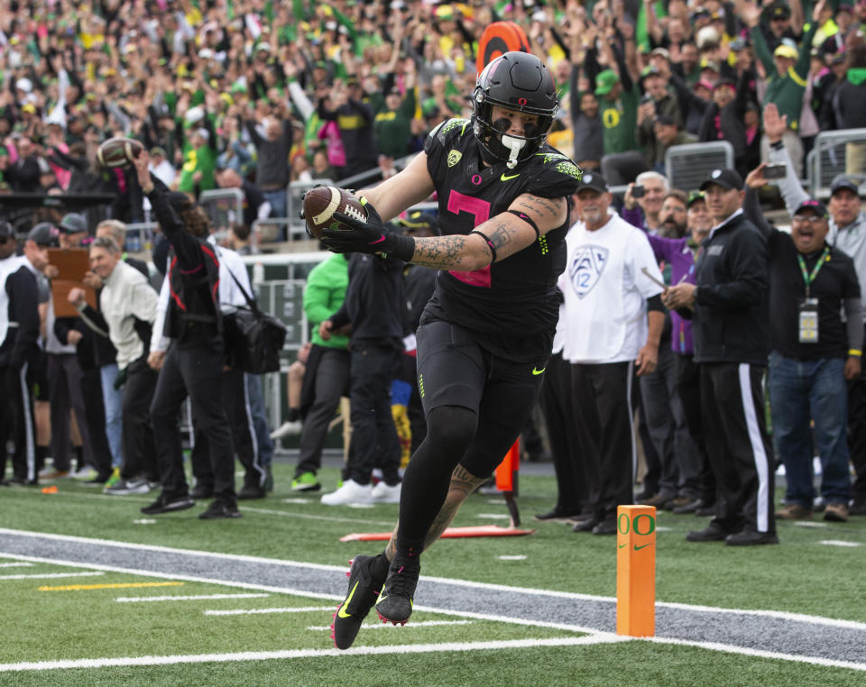 Oregon's Terrance Ferguson scores against UCLA during the first half of an NCAA college football game Saturday, Oct. 22, 2022, in Eugene, Ore. (AP Photo/Chris Pietsch)