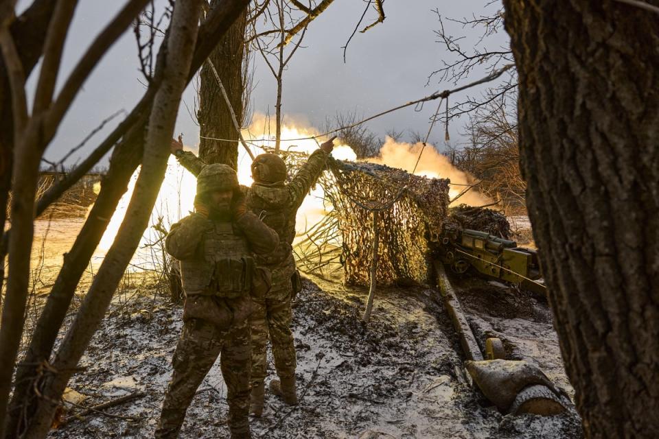 Ukrainian military soldiers fire at Russian positions in Avdiivka earlier this month (Getty)