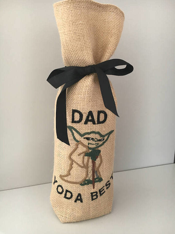 $6.05, Mimosa Crafts. <a href="https://www.etsy.com/listing/528692029/star-wars-yoda-wine-bottle-bag-fathers" target="_blank">Buy here</a>.