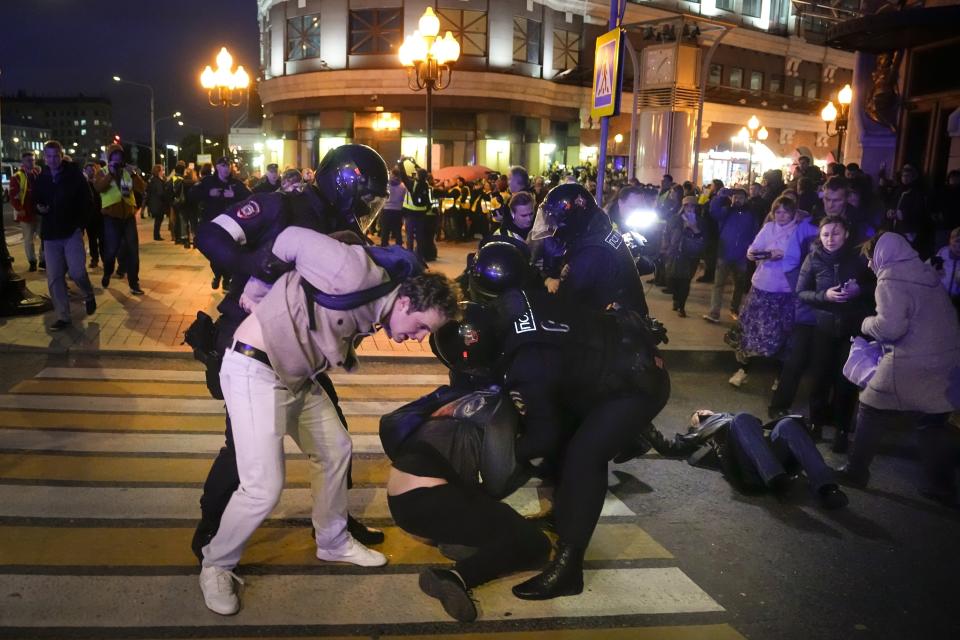 FILE - Riot police detain two young men at a demonstration in Moscow, Russia, on Sept. 21, 2022. The crackdown by Russian President Vladimir Putin affects not only opposition politicians but also independent voices and those who don't conform to what the Kremlin sees as the country's "traditional values." (AP Photo, File)