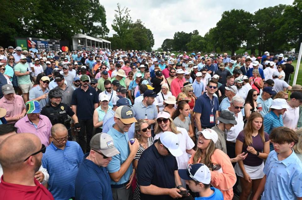 Fans mingle around the 10th green during second round action of the Wells Fargo Championship at Quail Hollow Club in Charlotte, NC on Friday, May 10, 2024.