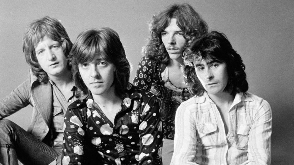 Group of men sitting on the floor; badfinger