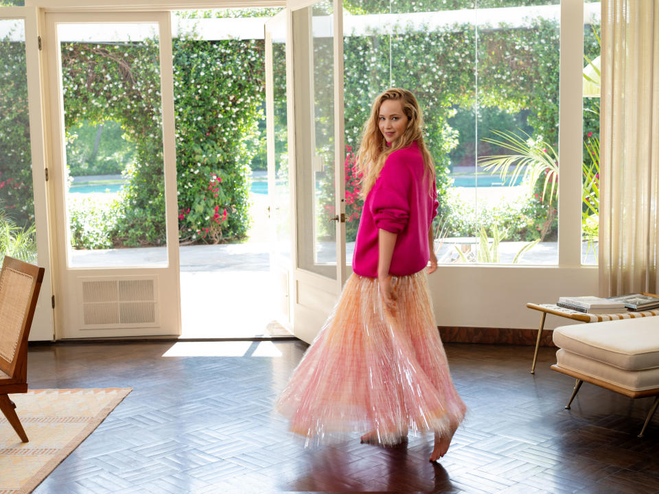 Lawrence, 32, pictured here in a Brandon Maxwell sweater and skirt, is full of joy after the birth of her son Cy. (Photography by Tonne Goodman for Vogue) 