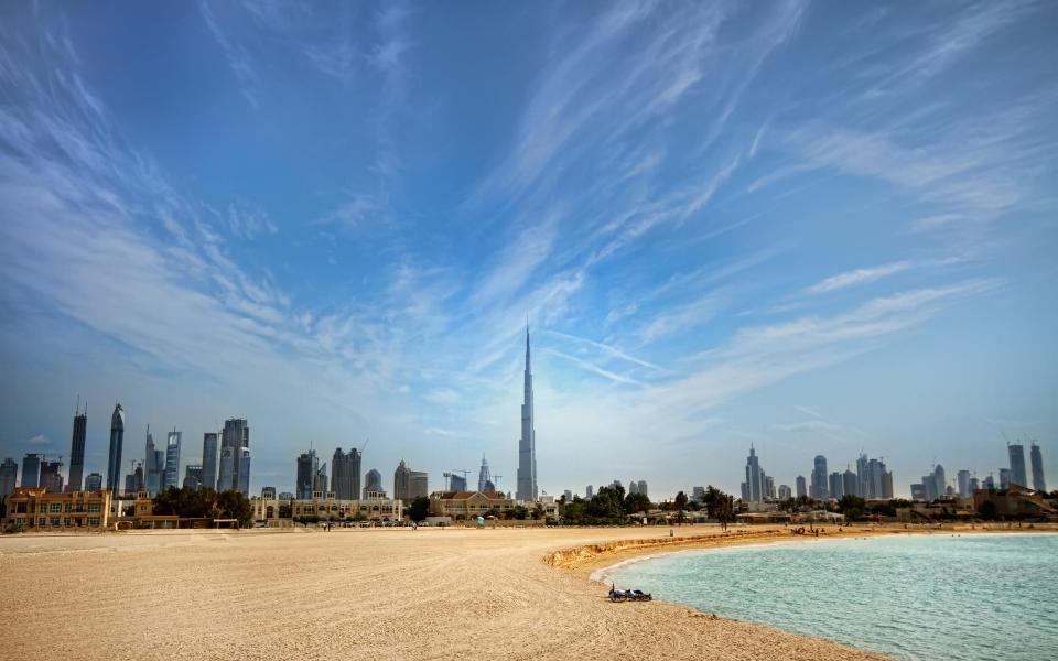 Dubai skyline at Jumeirah beach - Michael R. Cruz /Getty 