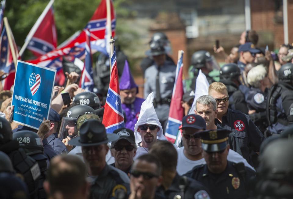 Members of the Ku Klux Klan arrive for a rally, calling for the protection of Southern Confederate monuments, in Charlottesville, Virginia: ANDREW CABALLERO-REYNOLDS/AFP/Getty Images