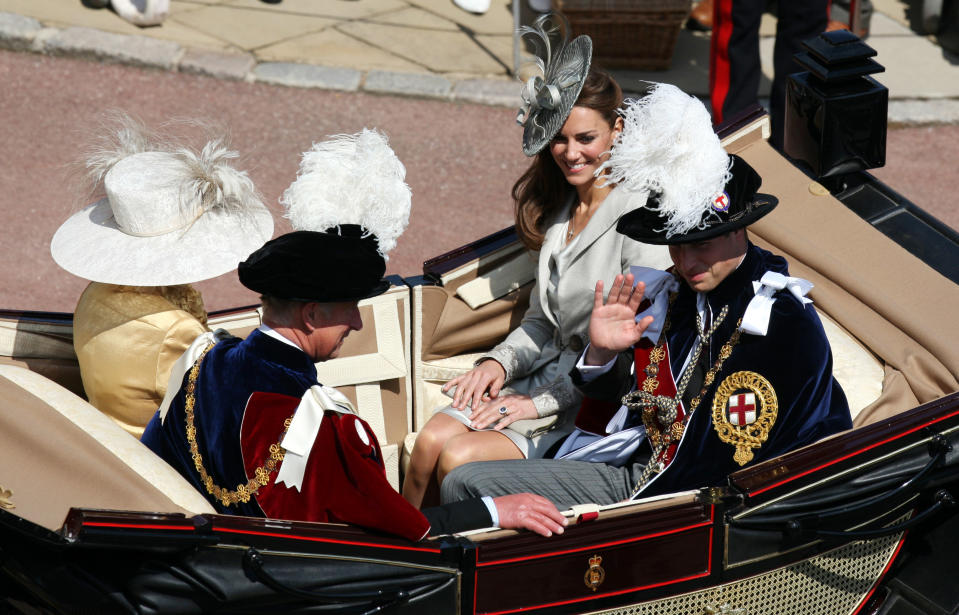 <div class="caption-credit">Photo by: Steve Parsons - WPA Pool/Getty Images</div><div class="caption-title"><b>This is how they leave parties.</b></div> <br> This four-seater chariot carried Kate, her husband and her in-laws home from the annual Order of the Garter chivalry service, a tradition that began in 1348. That may explain why the only two people wearing giant feathers are men. <br>