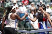 Mar 26, 2018; Key Biscayne, FL, USA; Sloane Stephens of the United States (L) shakes hands with Garbine Muguruza of Spain (R) after their match on day seven of the Miami Open at Tennis Center at Crandon Park. Stephens won 6-3, 6-4. Mandatory Credit: Geoff Burke-USA TODAY Sports