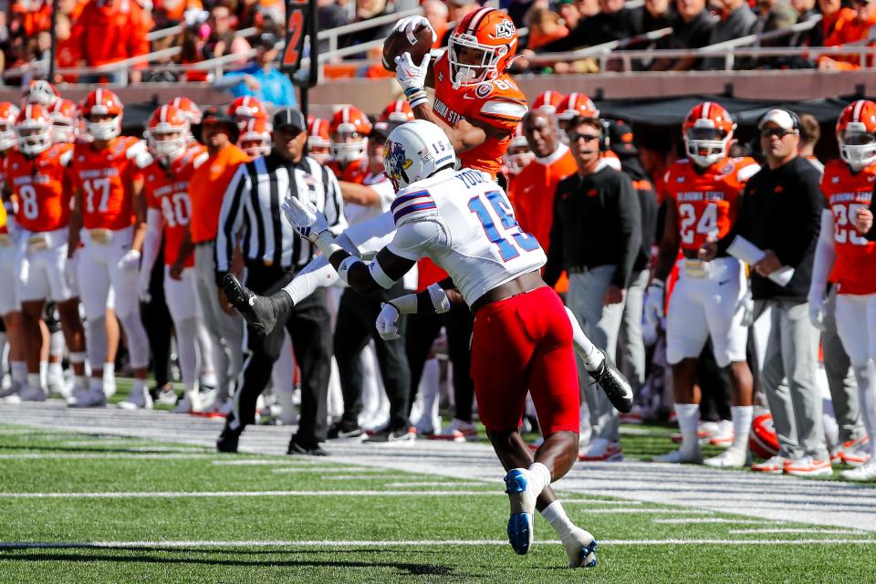Oklahoma State receiver Brennan Presley catches a pass and braces for a hit in a game against Kansas earlier this year.