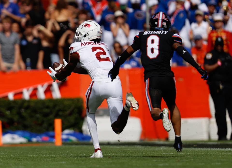 Arkansas Razorbacks wide receiver Andrew Armstrong (2) catches a first down pass in front of Florida Gators cornerback Jalen Kimber (8) in the first half at Steve Spurrier Field at Ben Hill Griffin Stadium in Gainesville, FL on Saturday, November 4, 2023. [Matt Stamey/Gainesville Sun]