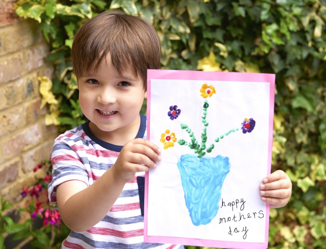 four year old with mothers day card