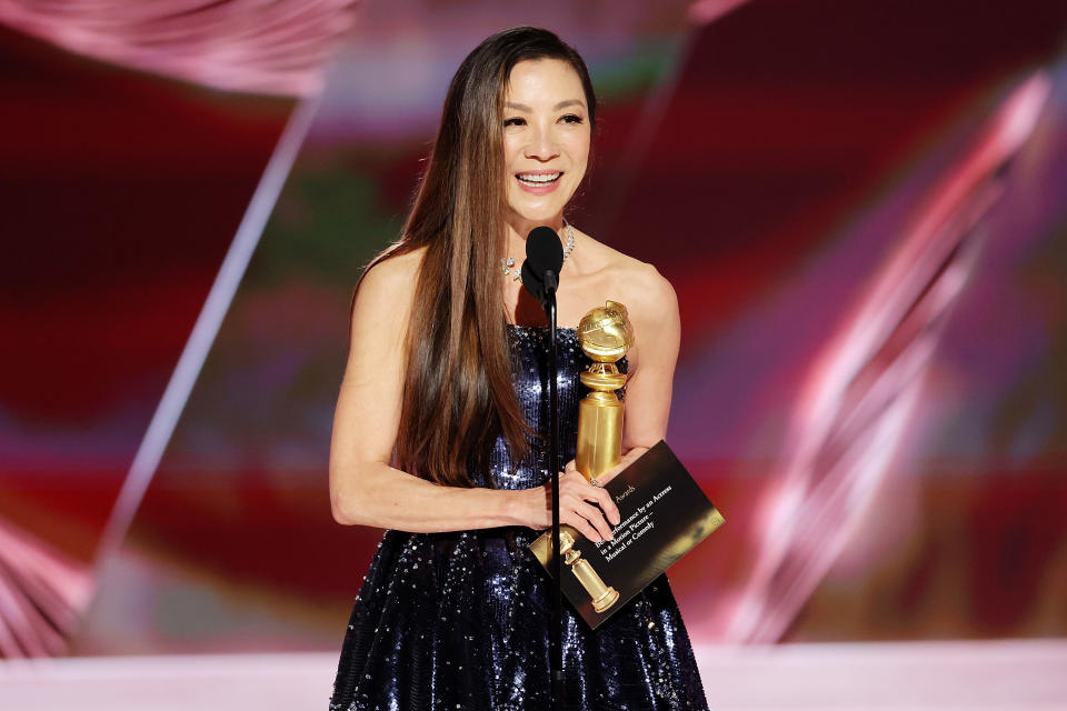BEVERLY HILLS, CALIFORNIA - JANUARY 10: 80th Annual GOLDEN GLOBE AWARDS -- Pictured: Michelle Yeoh accepts the Best Actress in a Motion Picture – Musical or Comedy award for 