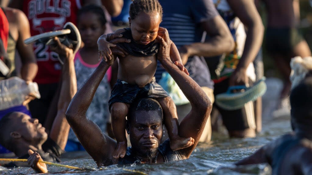 Haitian immigrants cross the Rio Grande back into Mexico from Del Rio, Texas on September 20, 2021 to Ciudad Acuna, Mexico. (Photo by John Moore/Getty Images)