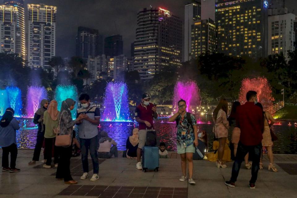 People celebrate New Year’s Eve at the KLCC park in Kuala Lumpur, December 31, 2020. — Picture by Firdaus Latif