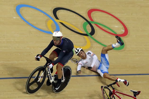 Park Sang-hoon of South Korea, right, falls near Mark Cavendish of Britain, left, during the men's cycling omnium points race. (Photo: Pavel Golovkin/AP)