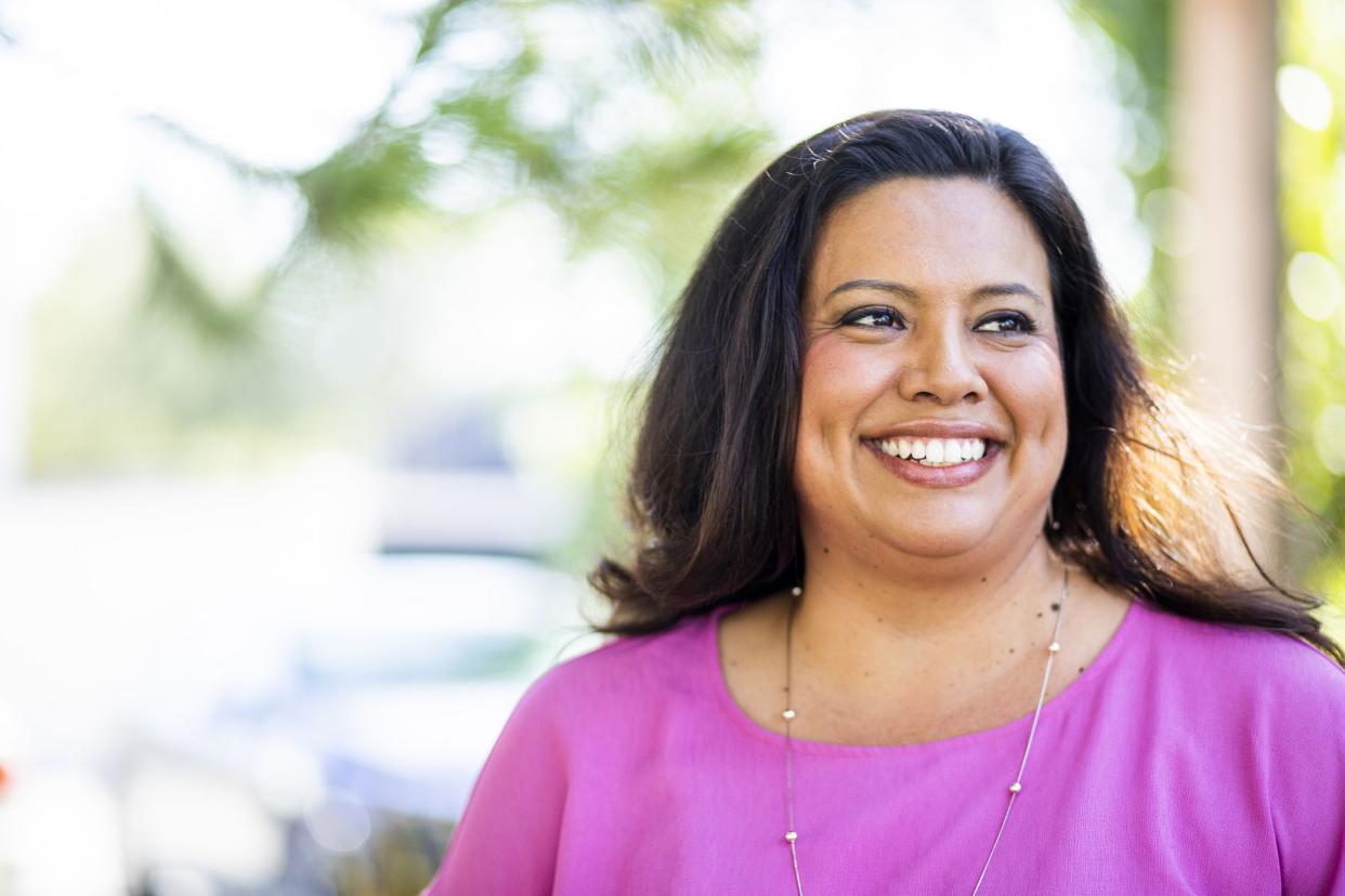 happy hispanic woman in the park