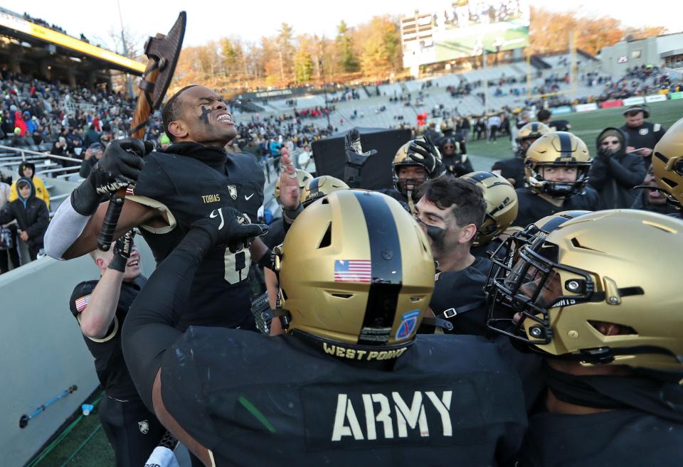 Army defensive back D'Andre Tobias (6) celebrates his late-game interception against Connecticut. DANNY WILD/USA TODAY Sports