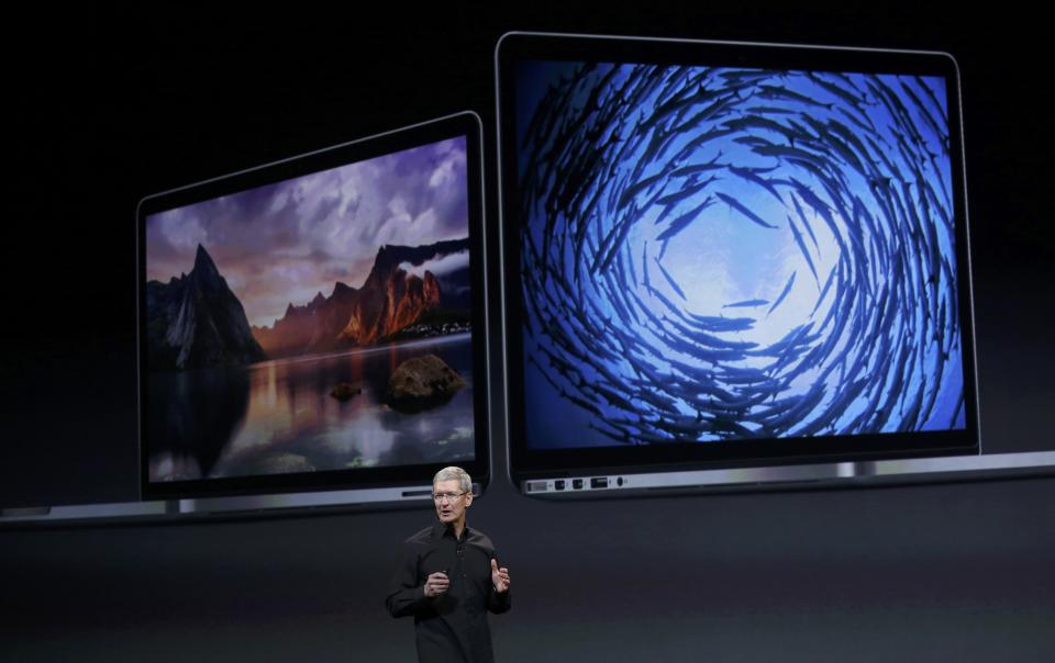 Apple Inc CEO Tim Cook speaks about their new Mac book computers during an Apple event in San Francisco