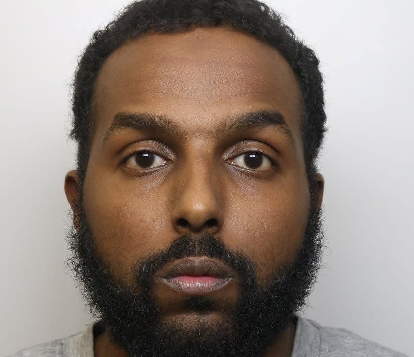 Abdulrizak Ali Hersi has been banned from standing near any woman he doesn't know in public after police caught him sexually assaulting a 13-year-old girl in front of her family. (BTP/SWNS)
