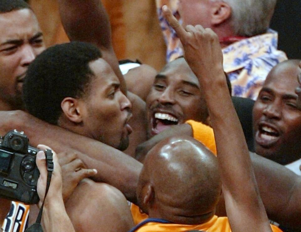 Robert Horry is mobbed by Lakers teammates, including Kobe Bryant, after his game-winner in the 2002 Western Conference finals. (Robert Sullivan/AFP via Getty Images)